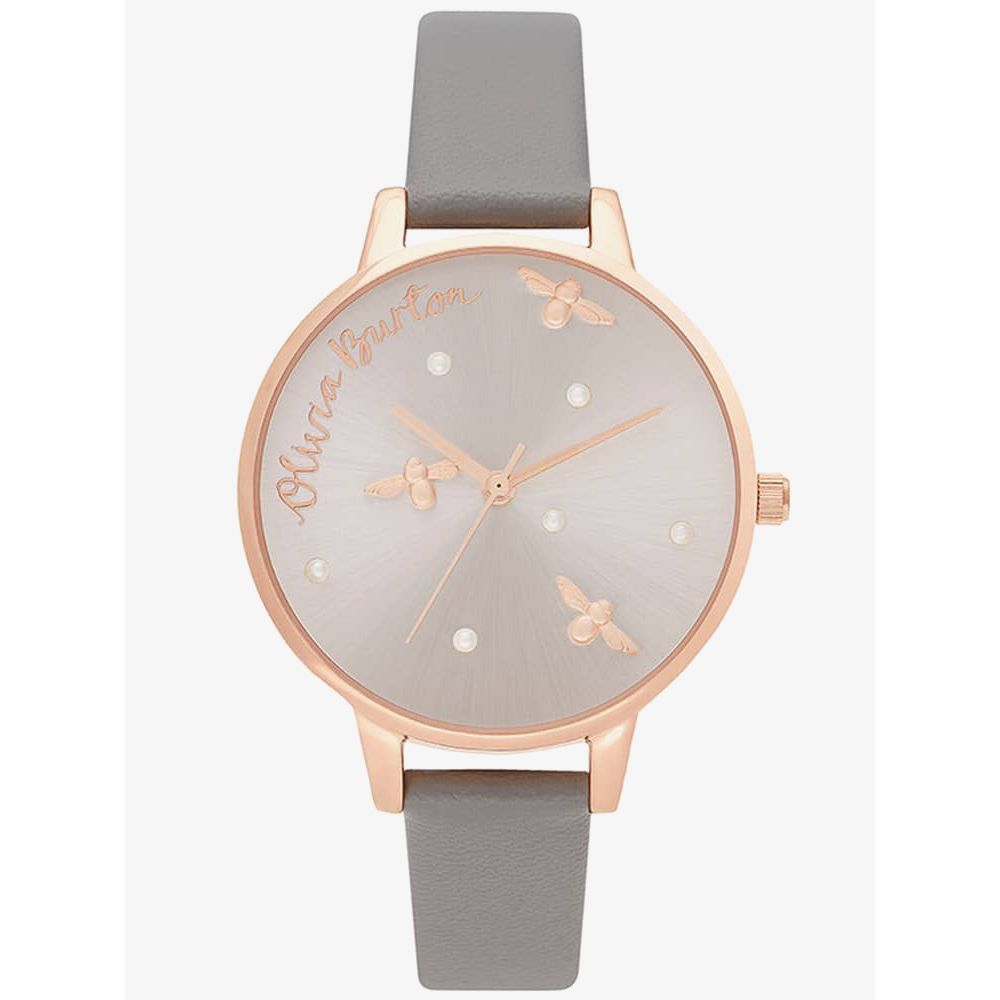 Wristwatch with rose gold case and gray strap on a white background