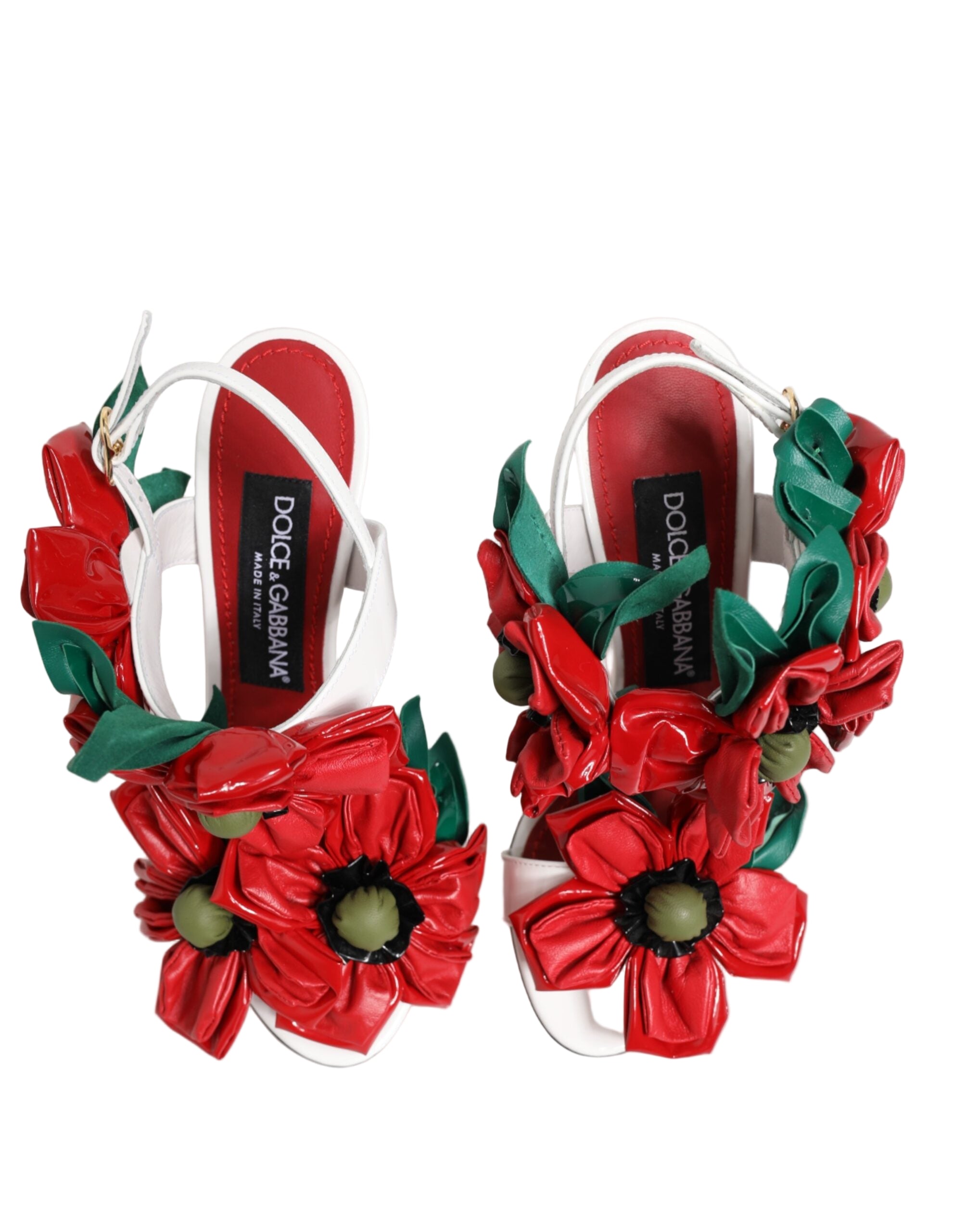 Red floral sandals with white straps on a light gray background