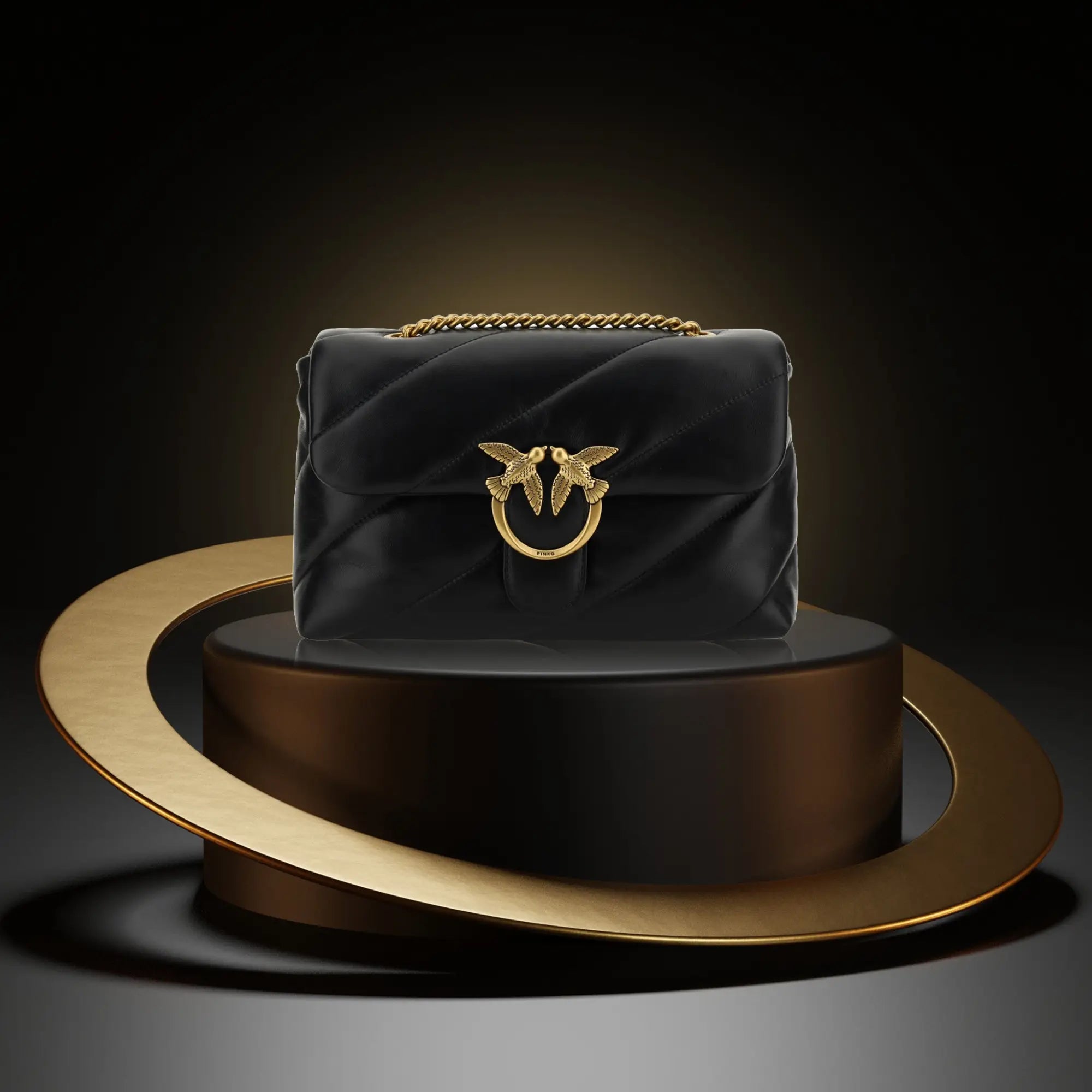 Black quilted leather handbag with gold chain strap in New Arrivals collection.