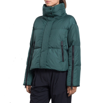 Green puffer jacket worn by a person on a white background