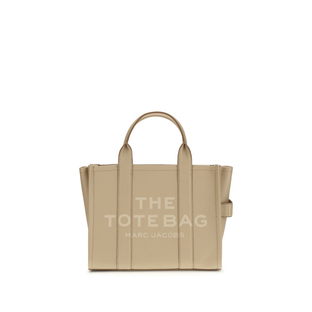 Beige tote bag with 'The Tote Bag' and 'Marc Jacobs' text on a white background