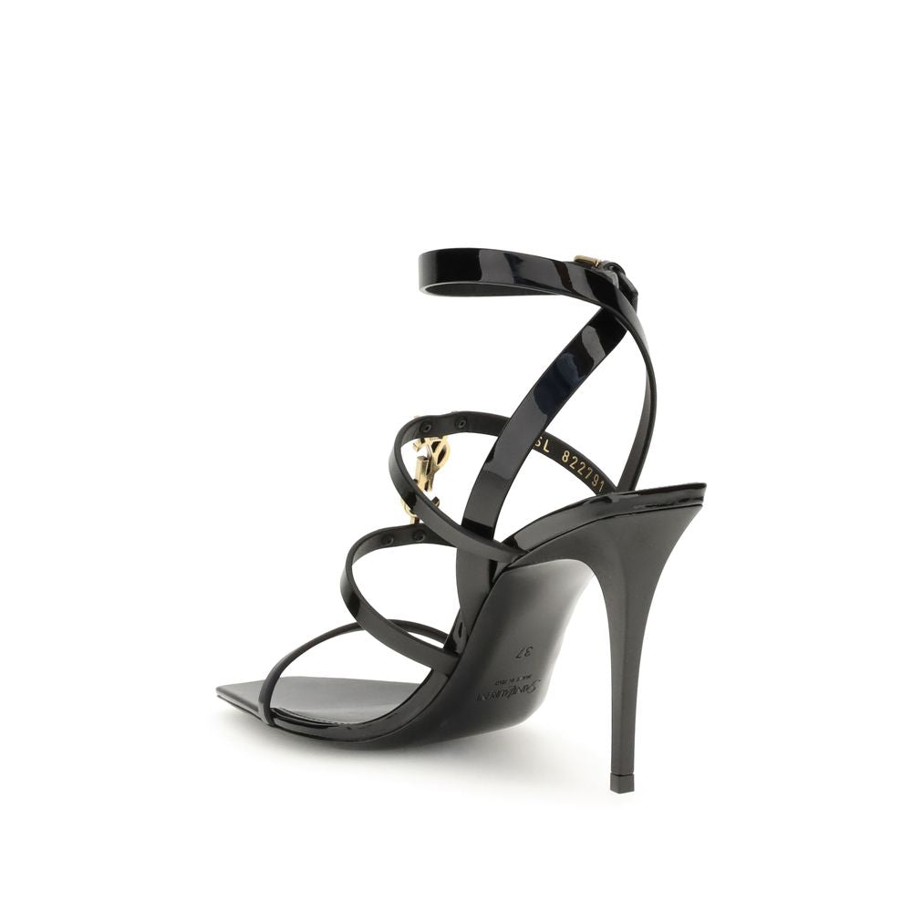 Black strappy high-heeled sandal on a white background