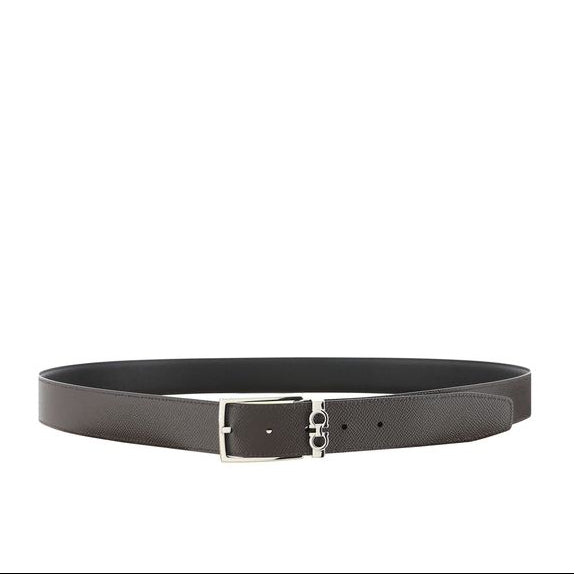 Black belt with silver buckle on a white background