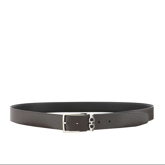 Black belt with silver buckle on a white background