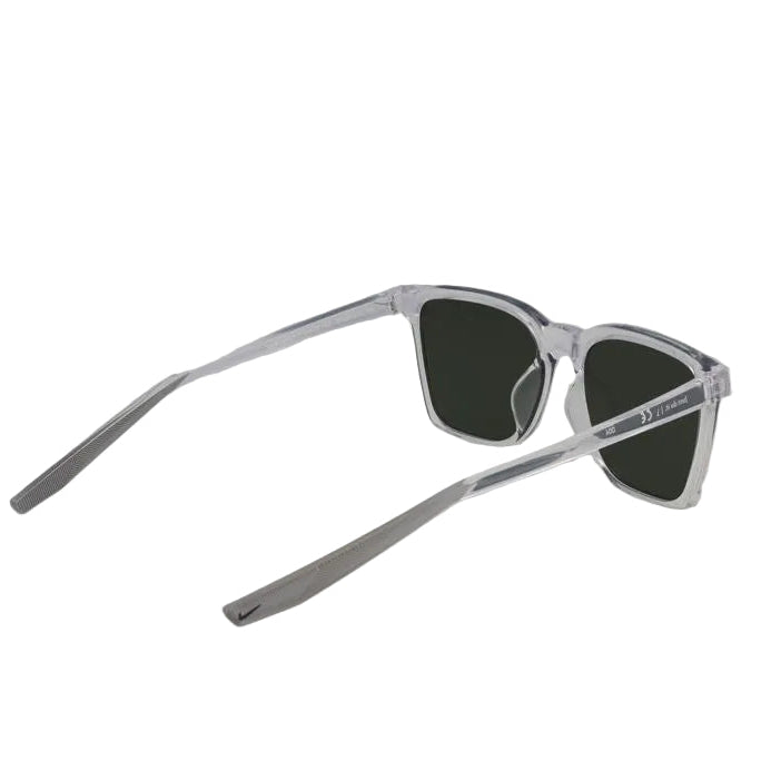 Sunglasses with clear frame and dark lenses on a light gray background