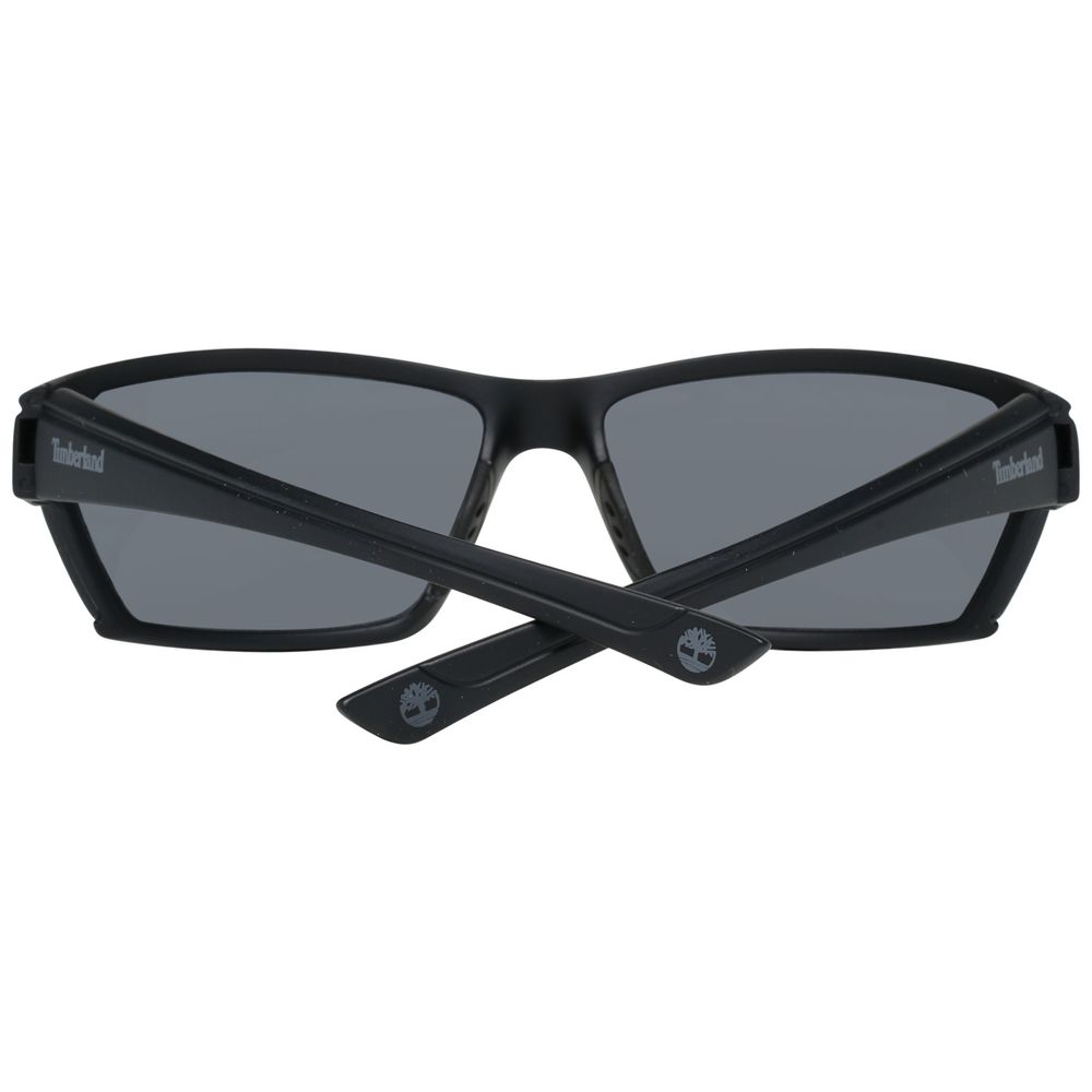 Black sunglasses with gray lenses on a white background