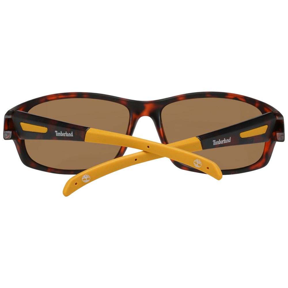 Sunglasses with tortoiseshell frame and yellow arms on a white background