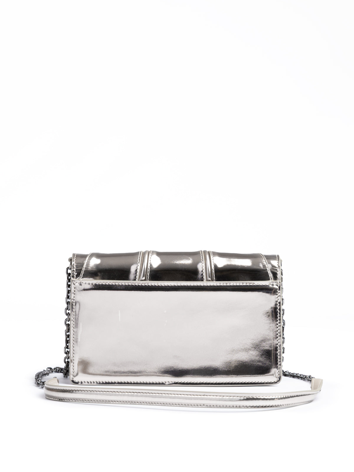 Silver clutch bag with embellishments on a white background