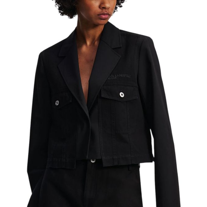 Black suit with jacket and skirt worn by a model on a white background
