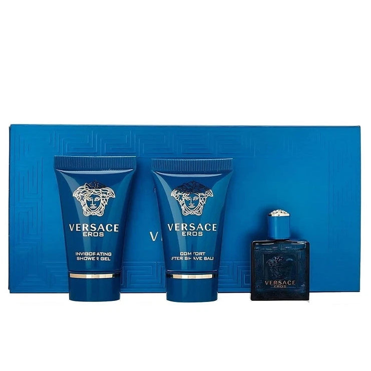Versace Eros grooming set with three blue bottles on a blue background