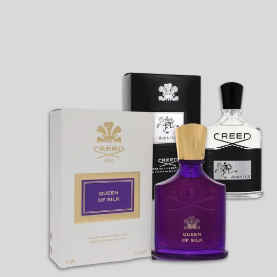 Creed perfume bottles and packaging on a light gray background